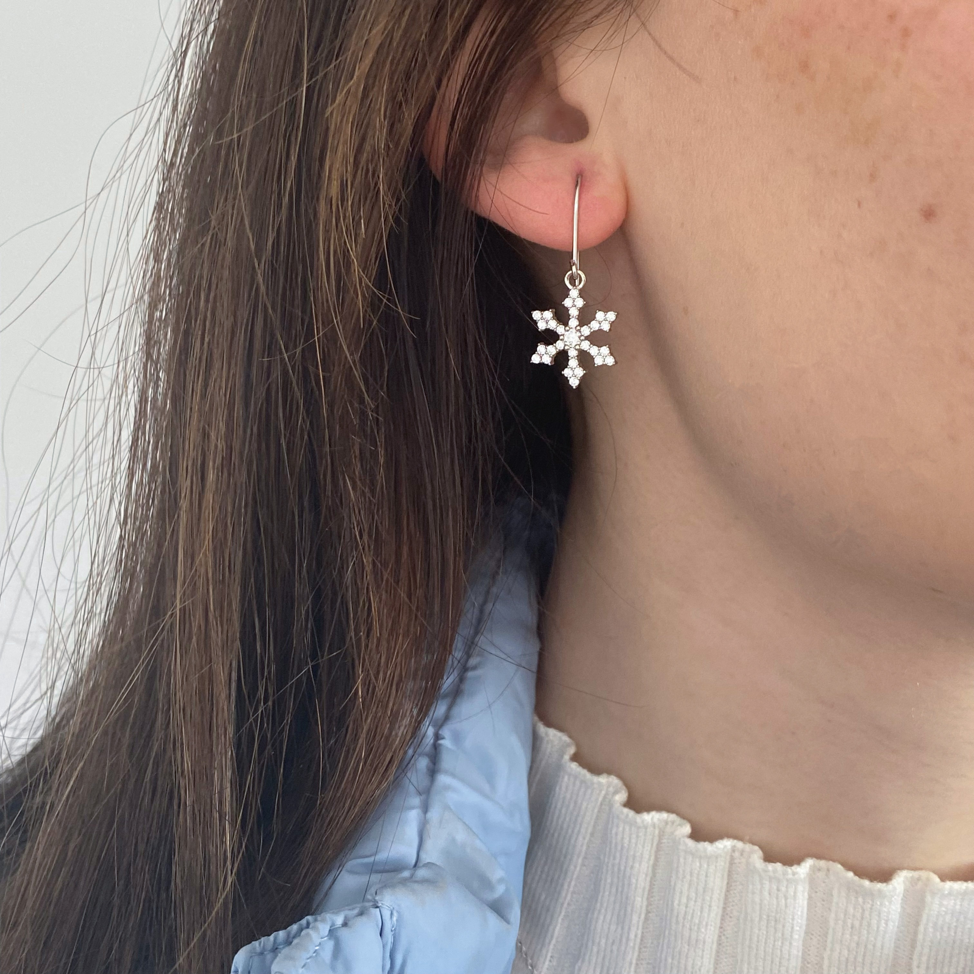 Olivia wearing the Shimmering Snowflake Earrings with Cubic Zirconia's